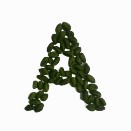 Pistachio kernels forming the letter A, a high-quality organic and conventional product for a wellness lifestyle.