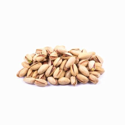 A pile of Akbari pistachios in shells, representing high-quality organic and conventional products for a natural health lifestyle.