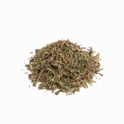 Pile of dried organic herbal tea leaves and medicinal herbs, perfect for a natural wellness lifestyle.