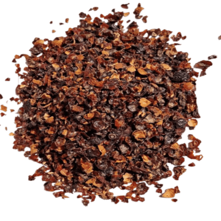 Heap of crushed organic rosehip shells, a vitamin-rich ingredient for natural health and traditional herbal tea.