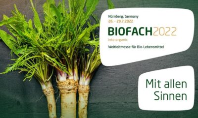 BIOFACH 2022 Nuremberg event banner with fresh root vegetables, promoting high-quality organic products and natural health.