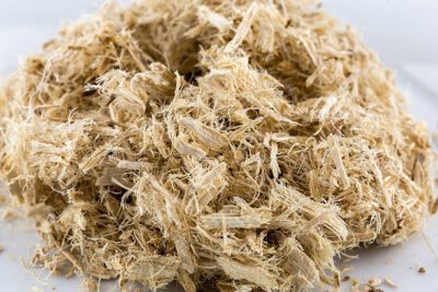 Shredded slippery elm bark, a staple for organic products and natural health in a holistic wellness lifestyle.