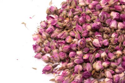A cluster of dry tea roses, a fragrant natural health ingredient for organic products and a wellness lifestyle.